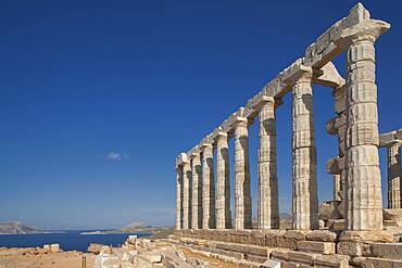 Temple of Poseidon ruins under blue sky, Cap Sunion, Greece