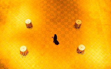 High angle view of woman walking on gold floor