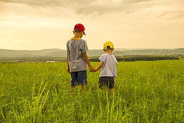 Mari brothers exploring in rural field