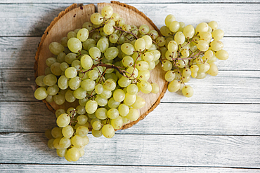 Green grapes on cutting board