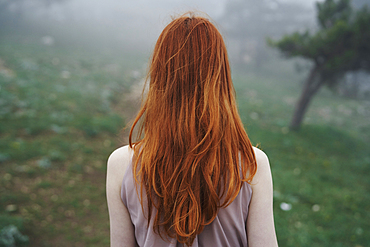 Rear view of Caucasian woman with red hair