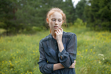 Portrait of Caucasian girl standing in field