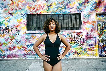 Portrait of confident mixed race ballet dancer in city