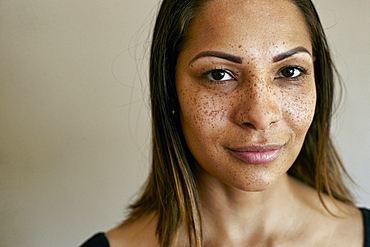 Close up of smiling mixed race woman