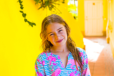 Smiling Caucasian girl with wet hair