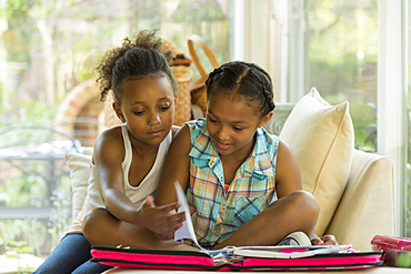 Portrait of girls doing homework