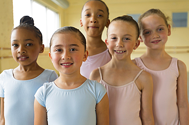 Portrait of smiling girls in ballet studio