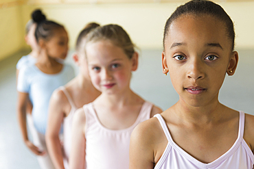 Girls standing in a row in ballet studio