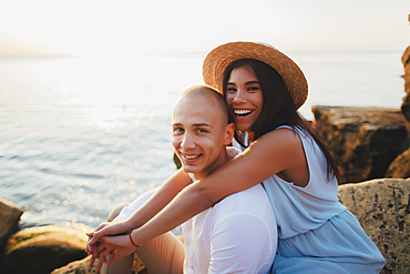 Portrait of smiling Caucasian couple at ocean