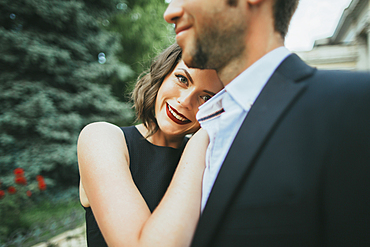 Portrait of smiling Caucasian couple hugging