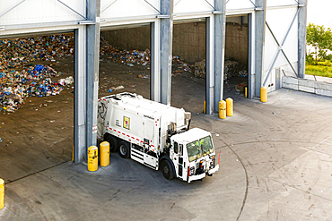 Garbage truck unloading trash