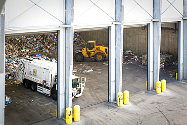 Garbage truck unloading trash