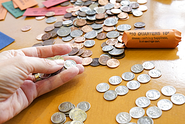 Hand holding coins