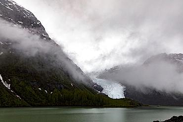 Fog over mountain lake