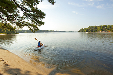 Man kayaking in lake