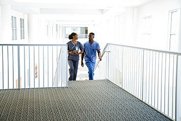 Nurses climbing staircase