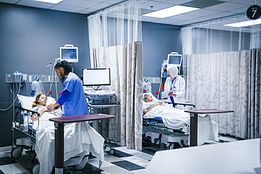 Doctor and nurse with patients in hospital