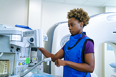 Black hospital technician wearing protective vest