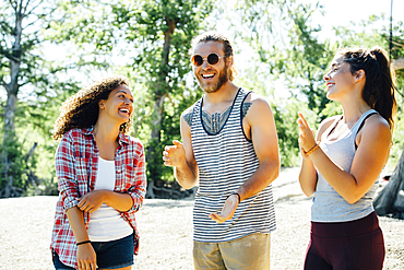 Friends laughing outdoors