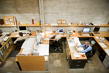 Business people working in busy office