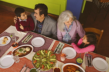 High angle view of grandparents and grandchildren in restaurant