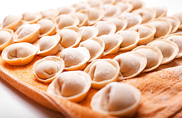 Rows of dumplings on towel