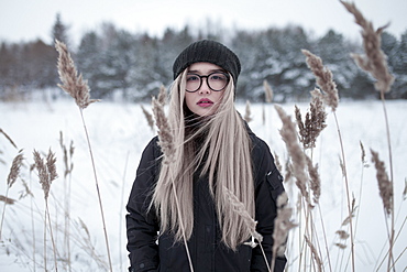 Wind blowing hair of Asian woman in winter