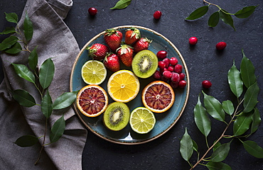 Plate of sliced fresh fruit