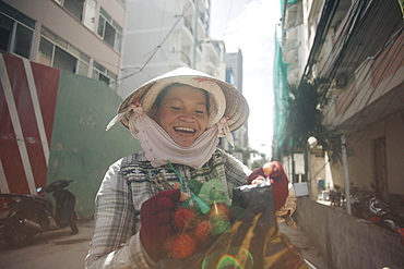 Vietnamese woman smiling in street