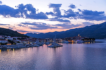 Scenic view of marina at sunset