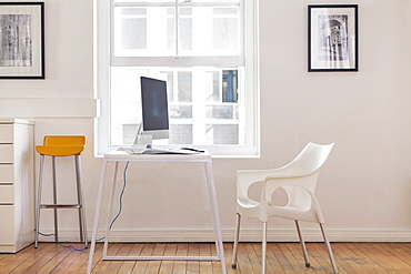 Empty chair and computer