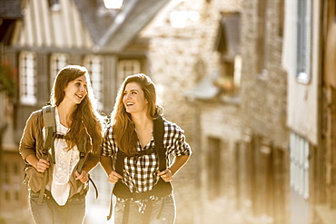 Caucasian women backpacking in city