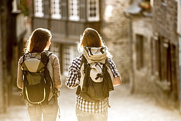 Caucasian women backpacking in city