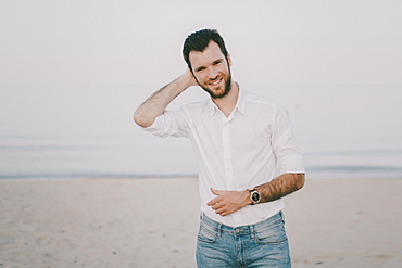 Caucasian man standing on beach