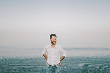 Caucasian man standing near ocean