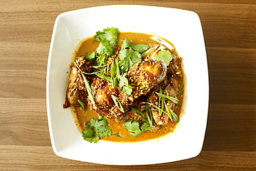 Meat and leaves in bowl