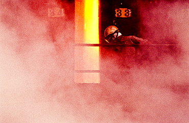 Person wearing mask in smoke