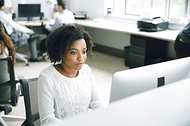 Businesswoman using computer in office