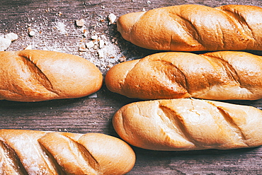 Loaves of bread on wooden table