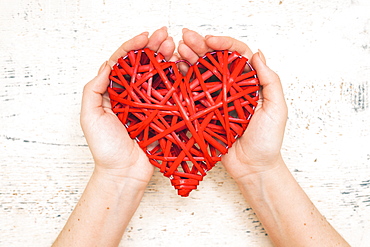 Hands of woman holding handmade valentine