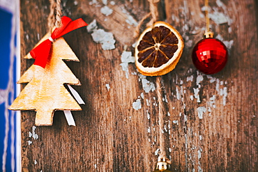 Christmas ornaments hanging on wood