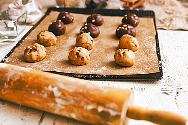 Cookie dough on baking sheet near rolling pin