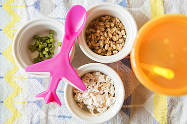 Airplane spoon on bowls of baby food