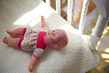 Doll on bed