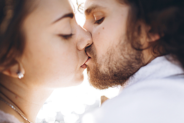 Close up of Middle Eastern couple kissing