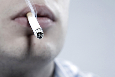 Caucasian man smoking cigarette