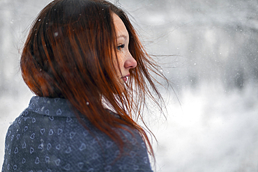 Hair of Caucasian woman blowing in wind in winter