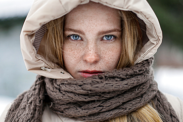 Caucasian woman wearing hood and scarf