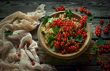 Berries in bowl on wooden table