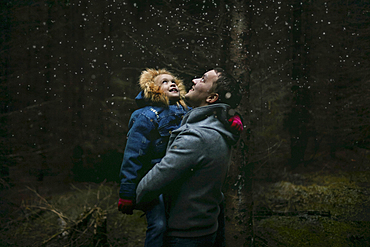 Caucasian father and daughter under starry sky